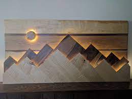 It comes in different styles and materials. Wood Mountain Range Wall Art The Sun Moon Functions As A Dimmer Switch For The Lights Behind The Mountain Ranges And The Su Wand Dekor Kunst Auf Holz Diy Wand