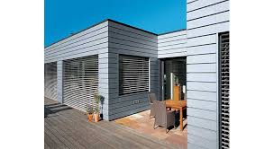Maison de plain pied avec toiture monopente zinc sur pièce de vie déplafonnée et toit plat sur le reste de la maison. Facade En Zinc Une Protection Ecologique Esthetique Et Longue Duree
