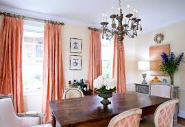 It has a small dining table for four that sits on hardwood flooring. Serene Coral Combinations Mint Grey Cream