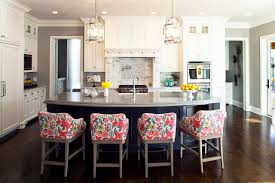 The curved center island features a space for a breakfast bar. Curved Island With Seating Overhang And Kitchen Ideas Photos Houzz