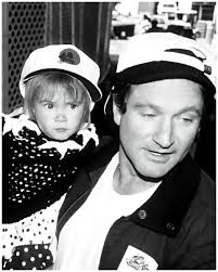 In 1989, Robin Williams welcomed his second child, a daughter named Zelda  Rae Williams. This picture shows a heartwarming interaction between the  beloved actor and his young daughter, offering a rare look