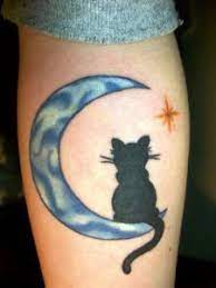 10 Inspirational Moon Tattoo Designs For Women Flawssy Blue Moon Tattoo Black Cat Tattoos Cat Tattoo