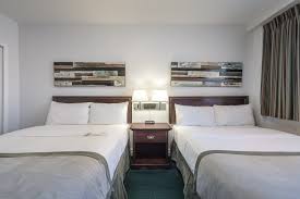 Bed features include raised panels on the headboard and footboard. Superior Suite 2 Beds