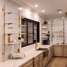 Check spelling or type a new query. Rack Style Cantilevered Shelving In A Polished Brass Un Lacquered Finish With Ball Style Wall Mounts With Glass Shelving By Cooper Pacific Kitchens West Hollywood Ca Sinklegs