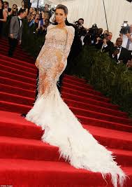 Kim has actually revealed the inspiration behind tonight's dress pick, and it was in fact a big time singer.just not beyoncé. Kim Kardashian Flashes Flesh In A Sheer Roberto Cavalli Gown At Met Gala 2015 Daily Mail Online