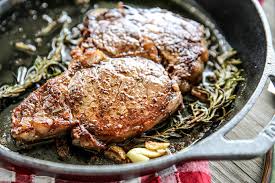Add butter, garlic, and thyme to skillet. How To Cook The Perfect Butter Basted Skillet Steak Our Best Bites