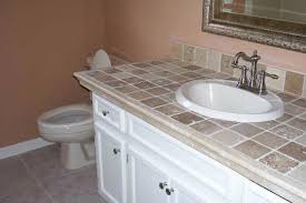 There is a master bath with two sinks and two side walls on the counter. Tile Bathroom Countertops Liberty Home Solutions Llc