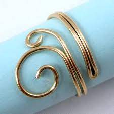 With the square nose pliers gripping the shorter stem of wire, begin a spiral by bending and curving the longer length of wire with your fingers to make a flat loop. Easy Folded Wire Ring Tutorial Jewelry Making Journal