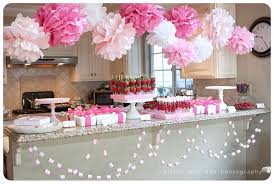 Hanging Pom Poms From Ceiling With Images Baby Shower Candy Pink Baby Shower Baby Shower Inspiration