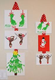 Over 20 Christmas Hand And Footprint Ideas The Keeper Of The Cheerios Diy Christmas Canvas Christmas Prints Handprint Crafts