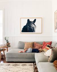 Cosy Living Room With Grey Sofa Mix And Match Cushions And White Washed Wood Panel Walls Courtney Ad Grey Sofa Living Room Cosy Living Room Living Room Wood