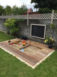 Landscaping ideas don't have to be filled with big changes. Finished Article Sandpit In Deck Kids Backyard Playground Backyard Play Backyard