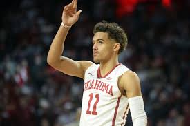 Scores 35 points in series opener. Trae Young Hoop Chain