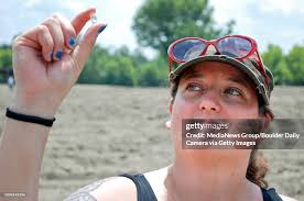 Bobbie Oskarson, of Longmont, holds her 8.52-carat diamond she found...  News Photo