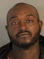 Man charged in driveway homicide