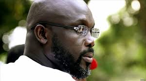George O. M. O. Weah, né le 1 octobre 1966 à Monrovia, est un footballeur  international et homme d`État libérien, élu président de la République le  26 décembre 2017