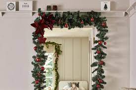 You'll find various tapestries with a christmas tree printed on them. 35 Showstopping Ways To Get Festive In Your Home Without A Tree Loveproperty Com