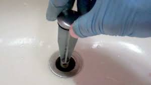 Unthread the sink stopper's tailpipe from the underside of the drain. How To Remove A Broken Drain Stopper