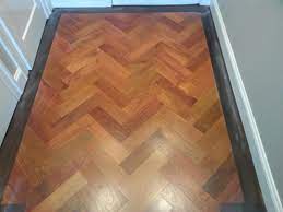 Custom Mahogany Floor In Herringbone Pattern With Walnut Border