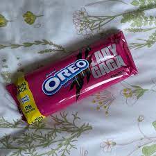 A pink golden oreo with green creme in the middle. The Haus News On Twitter Lady Gaga Chromatica Oreos Are Officially In The Uk And I Had To Grab Some Ladygaga Oreo