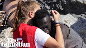 Street light in spanish is farol. Spanish Aid Volunteer Abused Online For Hugging Senegalese Migrant Migration The Guardian