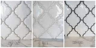 A framed arabesque tile accent on the shower wall ties together the color scheme. Pin On Tile Backsplash