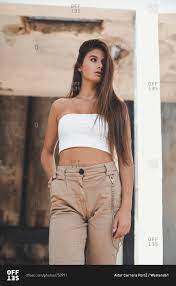 Give your hair a little messy look to give a normal look. Portrait Of A Fashionable Teenage Girl With Long Brown Hair Stock Photo Offset