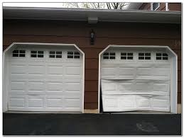 How Much Does It Cost To Repair A Garage Door Panel Garage Doors Door Repair Garage Door Repair