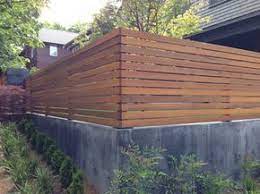 landscape retaining walls with fences installed ontop google search 庭 デザイン diy エクステリア 玄関 庭