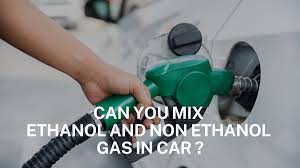 A classic car at a gas station, where the owner might choose to put non-ethanol gas in your car to protect its vintage engine.