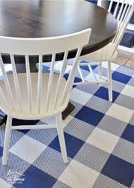 Rugs are a soft piece of furnishing that carpet the area under and around the table grounding it and the dining room chairs too. A Rug Under The Kitchen Table Practical Ideas For Making It Work The Homes I Have Made