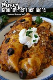 Cheesy Ground Beef Enchiladas Are Full Of Seasoned Ground Beef Two Types Of Cheese Black Olives Beef Enchilada Recipe Ground Beef Enchiladas Beef Enchiladas