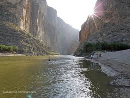 It is accessible via ox fire road off highway 9 and has a parking area located 0.75 miles south of the park's main entrance. People Swimming In The Rio Grande At Santa Elena Canyon In Big Bend National Park In Texas