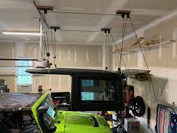 So, before hitting 'buy', you got to first check however, with a hoist, you can do it all by yourself, and without struggling. Inexpensive Jeep Hard Top Hoist Cheaperjeepertv