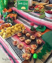Sweet potato wrapped black bean enchiladas. Mexican Inspired Theme Party Food Table Mexican Food Tacos Salsa Guacamole And Fruit Plates C Mexican Theme Party Food Party Food Themes Mexican Party Theme