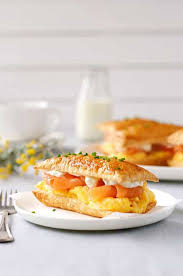 The classic option is to serve a slice of the fish on a pancake or blini, but try it out in homemade sushi, in tortilla rolls with cream cheese, or on toasted crostini too. Smoked Salmon And Egg Breakfast Mille Feuille Recipetin Eats