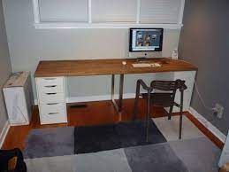 A storage cabinet is a perfect way to keep our rarities visible, yet away from dust and smudgy fingers. Giant Ikea Numerar Desk Ikea Workspace Ikea Wooden Desk Ikea Desk Hack