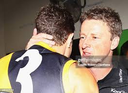 Jake Batchelor of the Tigers spoils the ball for Justin Koschitzke of...  News Photo
