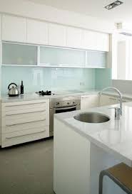 60 Amazing Glass Backsplash Ideas For Kitchen White Modern Kitchen Modern White Kitchen Cabinets Glass Backsplash Kitchen