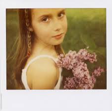 Polaroid Spectra Portrait Of A Girl Holding Fresh Picked Lilac Flowers" by  Stocksy Contributor "ALICIA BOCK"