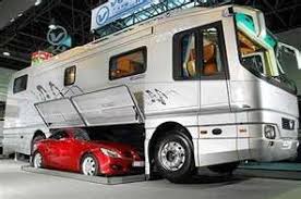 Luxury Caravan Has Sports Car Parking Dock In Its Belly Luxury Caravans Luxury Bus Recreational Vehicles