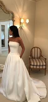 Minimalist wedding dress, ball gown wedding dress, long sleeve wedding dress, open back wedding, simple wedding dress, satin wedding dress. Simple Ivory Satin Strapless With Pockets Ball Gown Wedding Dresses Db0180 Weddingdresses Sophisticated Wedding Dresses Ball Gowns Wedding Ivory Wedding Dress