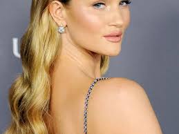 To stop it looking too severe, follow her example and leave two tendrils out. A Brief History Of Rosie Huntington Whiteley S Enviable Hair