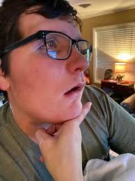 Taking glasses off for a cute photo