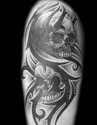 Extremely dangerous brown color tribal skull tattoo. 50 Tribal Skull Tattoos For Men Masculine Design Ideas