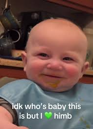 Charming Baby's Playful Smile Captivates Hearts