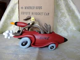 Honestly that nickle expression is just as bad. Warner Bros Looney Tunes Wile E Coyote In Rocket Car Statue Catawiki