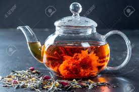 Glass teapot with stainless steel strainer and 8. Tea In A Glass Teapot With A Blooming Large Flower Teapot With Stock Photo Picture And Royalty Free Image Image 117756868