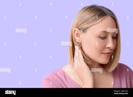 Ear pierce hi-res stock photography and images