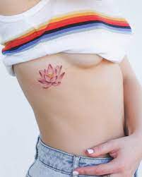 Pink Lotus Tattoo On The Right Rib Cage Pink Lotus Tattoo Neck Tattoo Lotus Tattoo